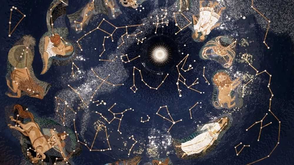 Night sky depicting the moon and stars with the zodiac constellations around it