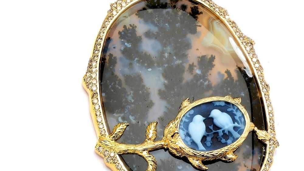 Close Up of a Cameo Carving Set on a Forest Agate Pendant with Diamonds on 18 karat yellow gold