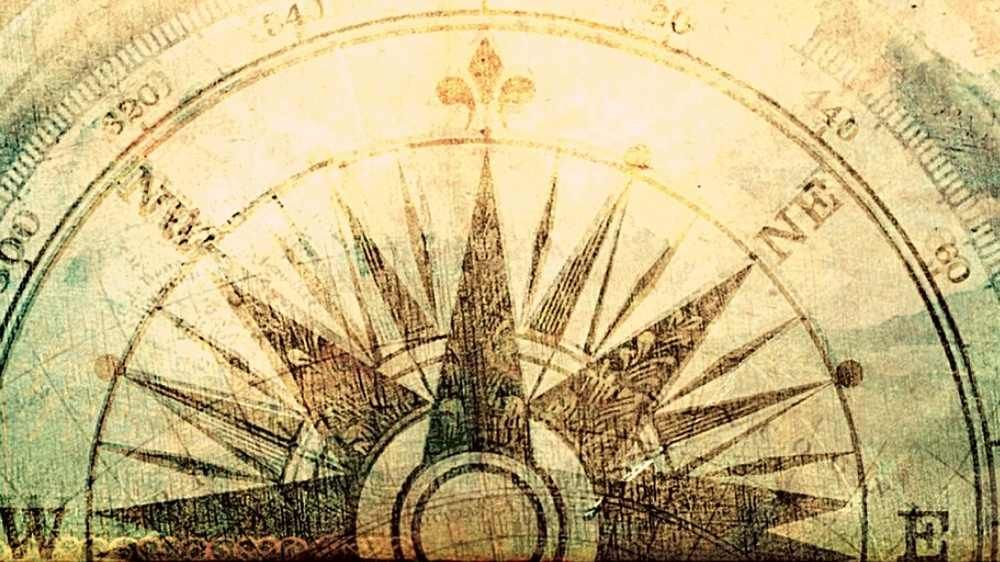 cross section of a vintage compass map shown blurred & glowing