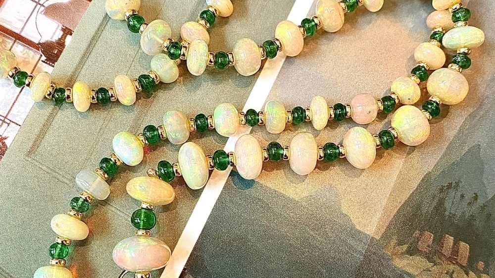 opal bead strand with tsavorite beads in between with gold rondells